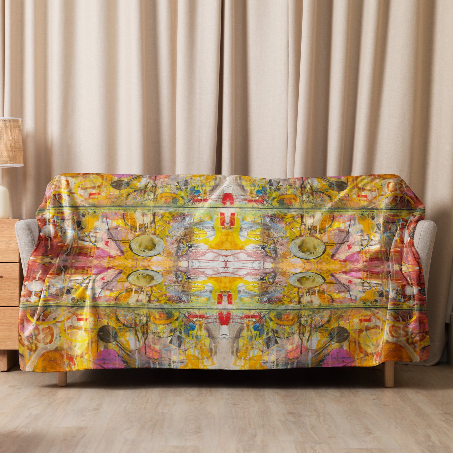 Colorful abstract patterned sofa cover on a wooden sofa against beige curtains.
