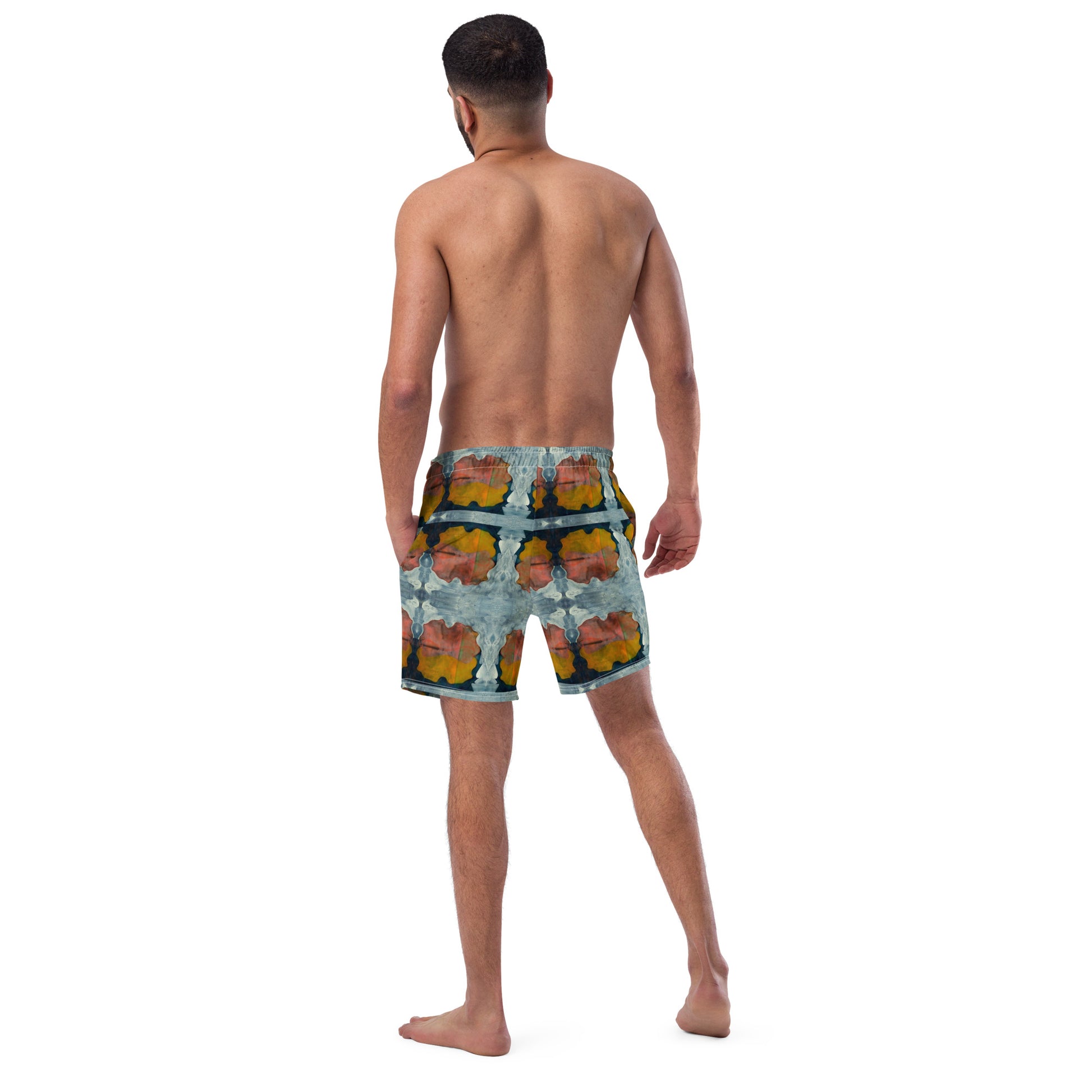Man wearing patterned shorts on a white background