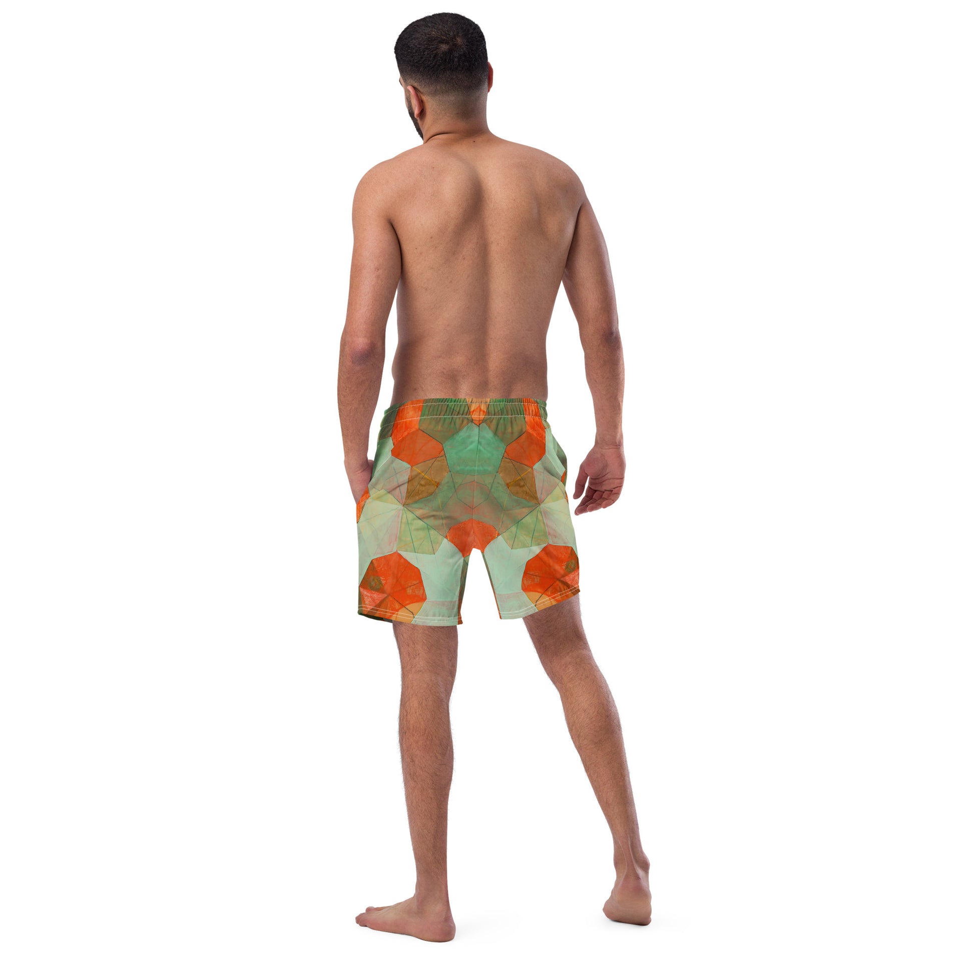 Man wearing patterned shorts on a white background