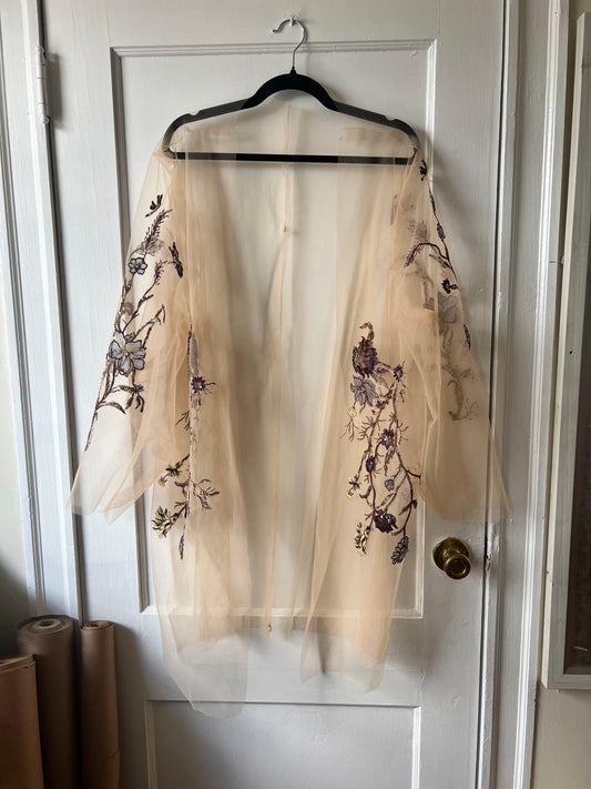 Upcycled Wedding Dress as sheer robe hanging on door